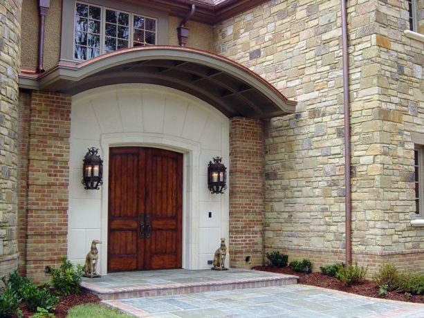 Front entranceway with arched French doors